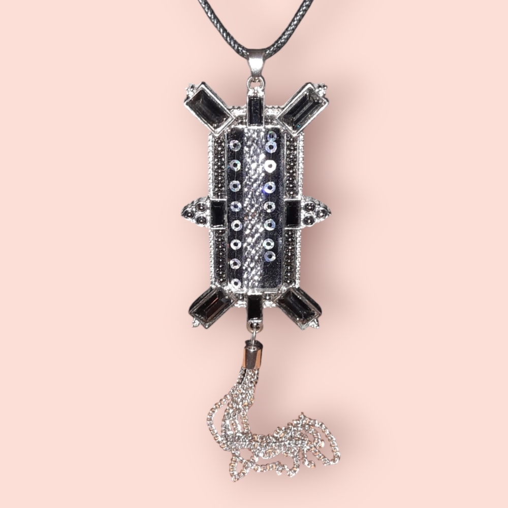 Statement Necklace on adjustable cord black silvertone tassel, clasp